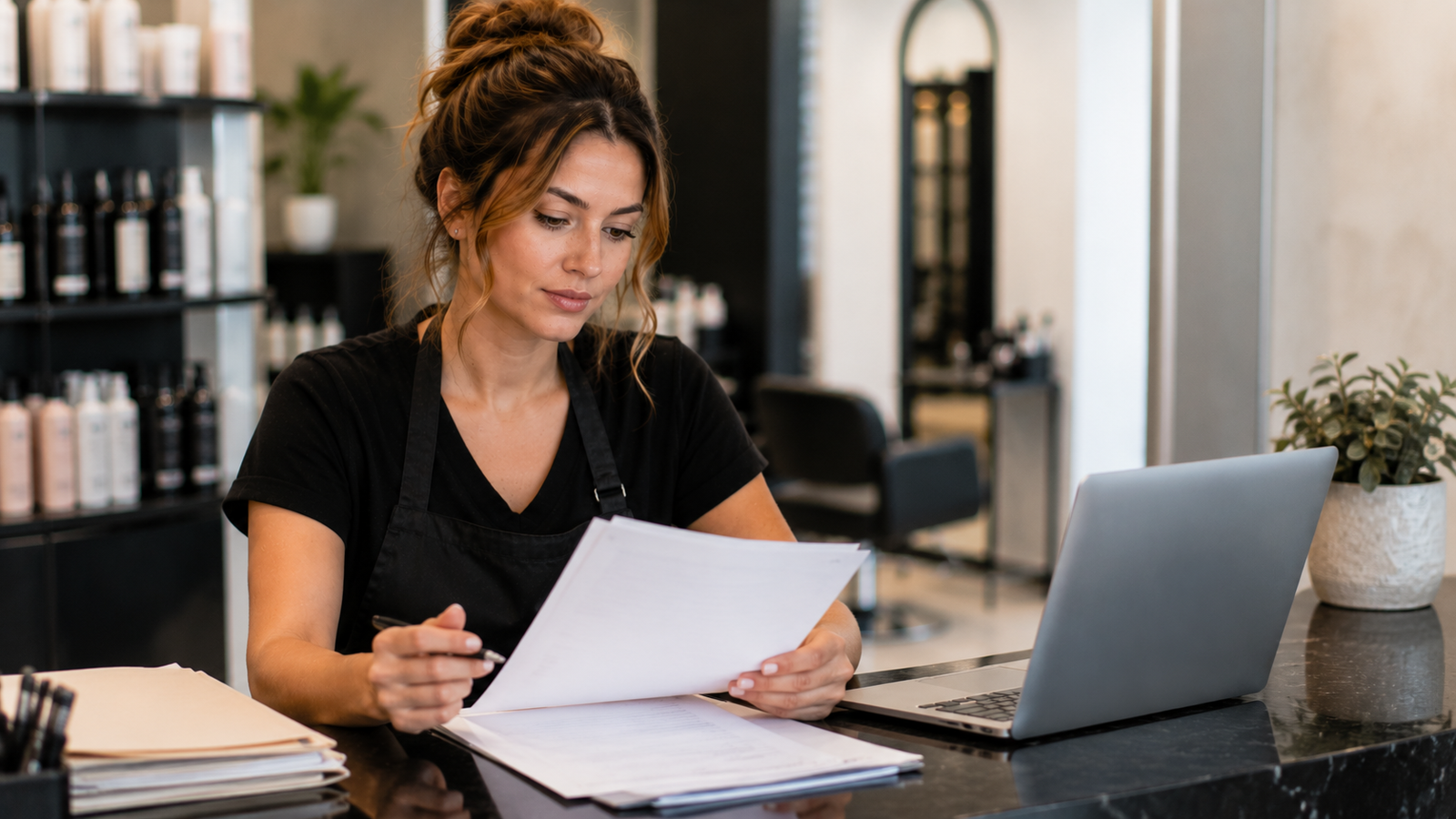 salon owner reviewing daily duties at the front desk